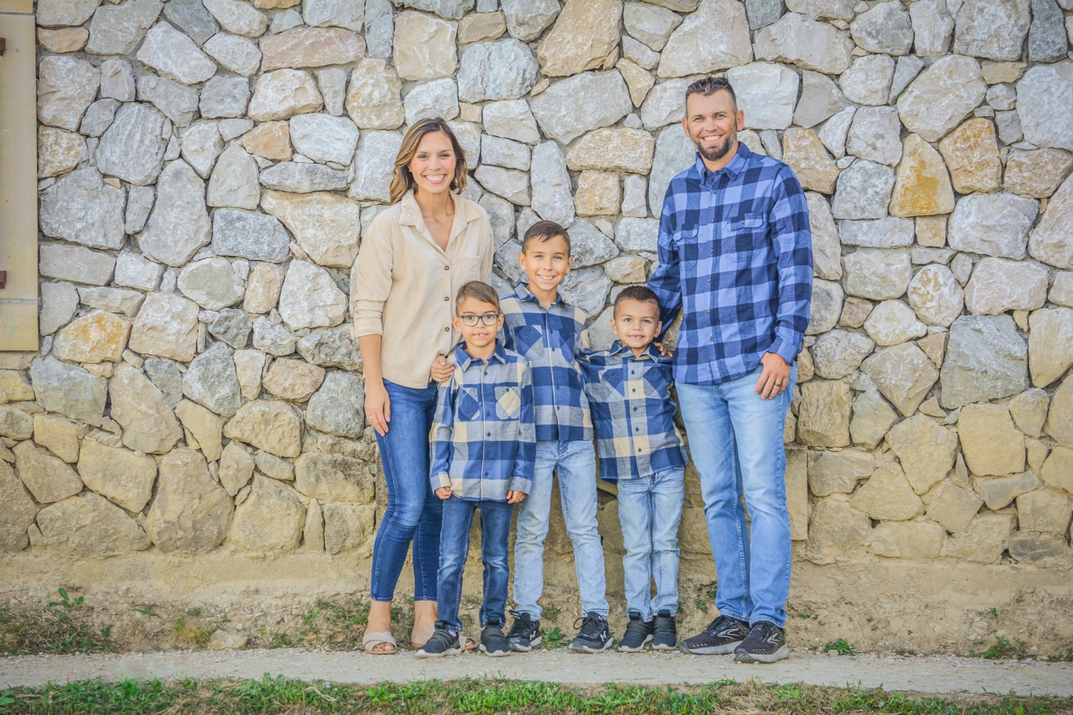 Matt, founder of Turf Refresh Co., with his wife and three sons