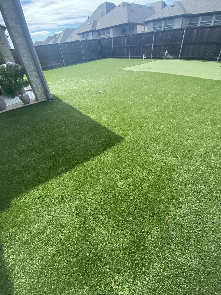 Second finished view of a 1,500-square-foot artificial turf lawn and backyard putting green in Aubrey, Texas