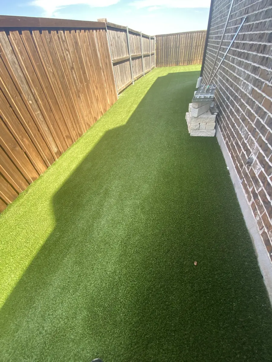 Finished 1,600-square-foot residential artificial turf lawn after professional cleaning in Prosper, Texas