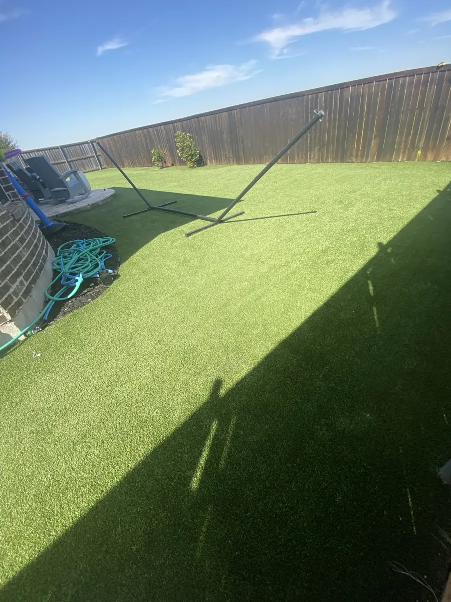 Finished artificial turf side yard and backyard after professional cleaning in Prosper, Texas
