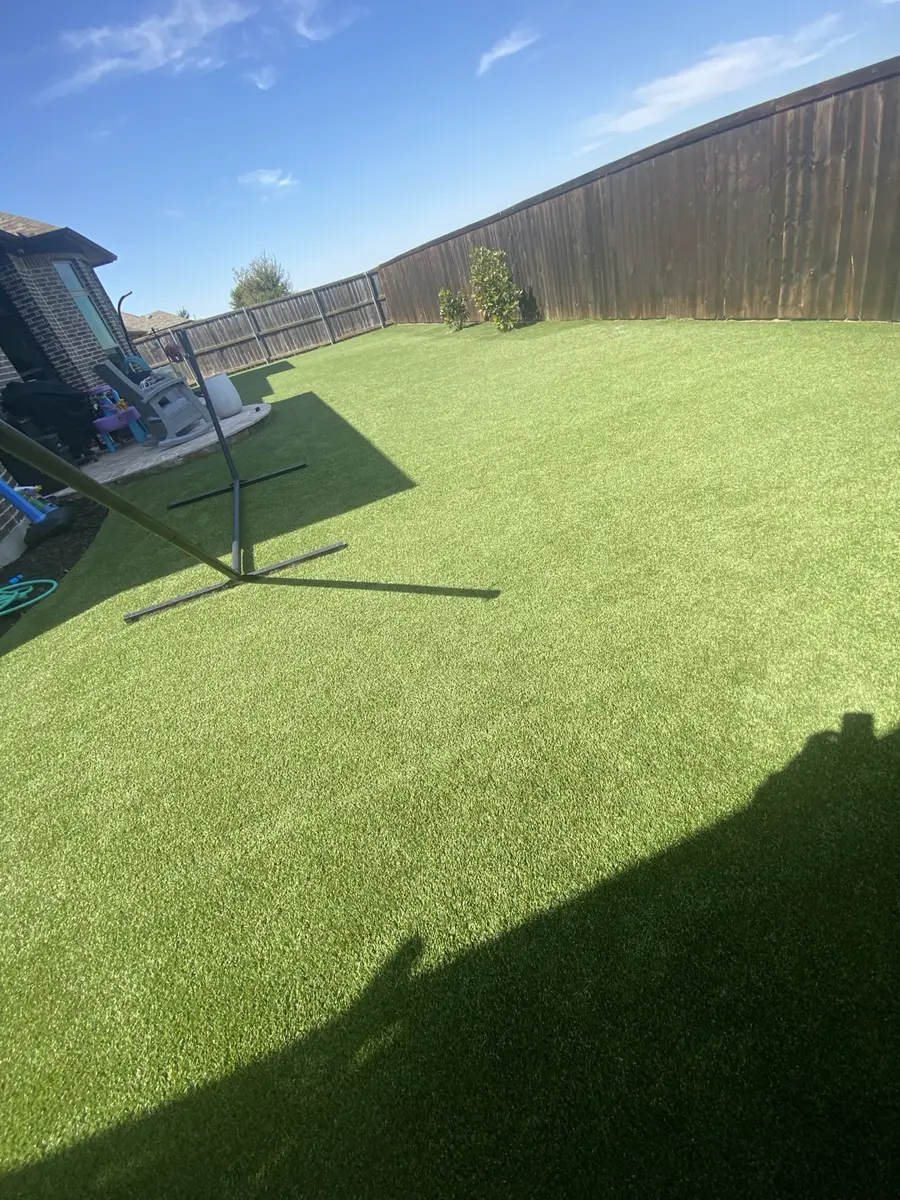 Wide completed view of professionally cleaned residential artificial turf in Prosper, Texas