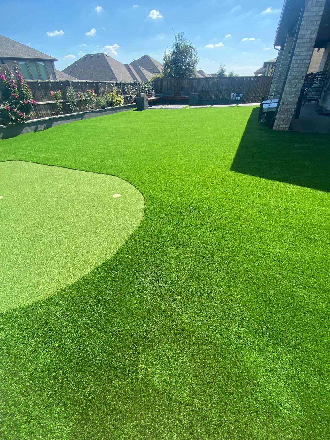 Second finished view of artificial turf and a putting green after a 2,000-square-foot cleaning in Celina, Texas