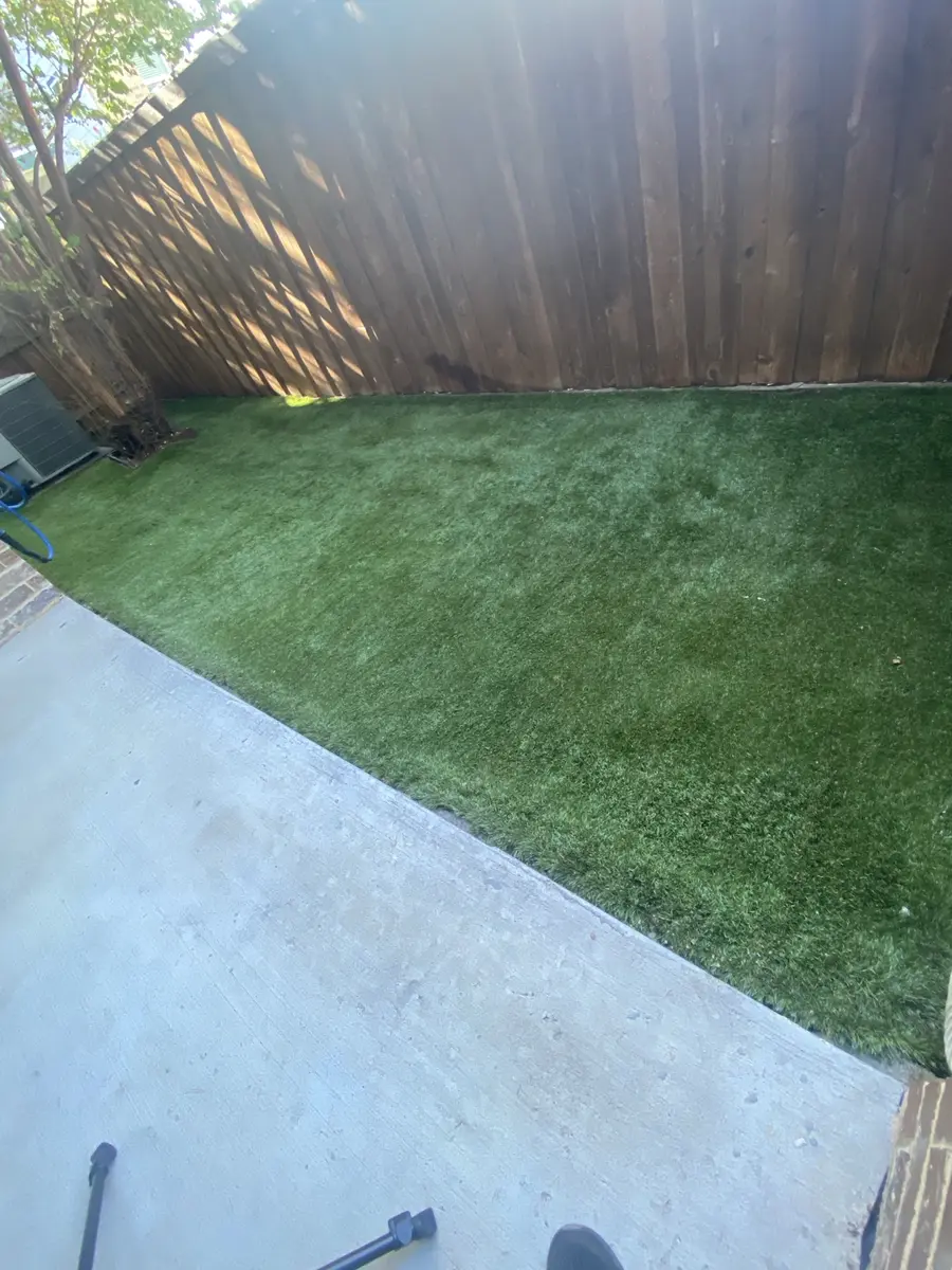 Finished 300-square-foot residential artificial turf area after professional cleaning in Dallas, Texas