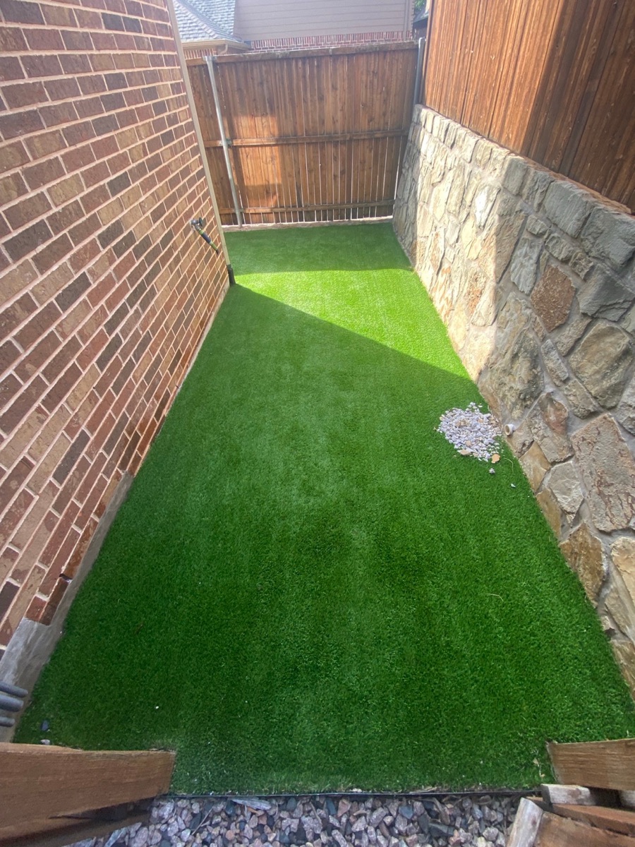 Finished view of a professionally cleaned 500-square-foot residential artificial turf area in Lewisville, Texas