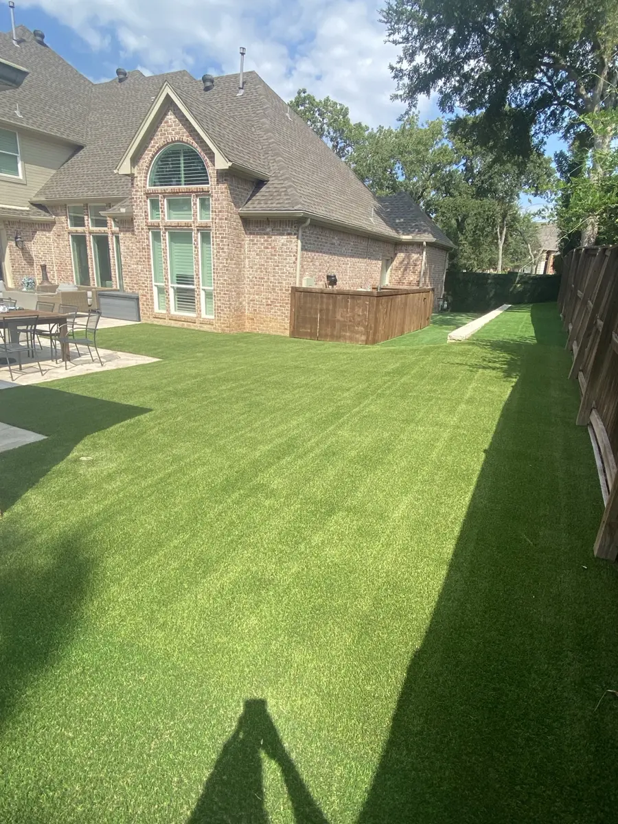 Large residential artificial turf lawn after professional cleaning in Southlake, Texas