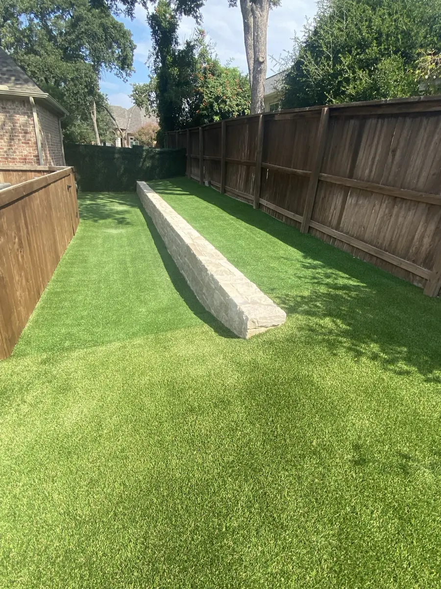Finished artificial turf across a multi-zone residential backyard