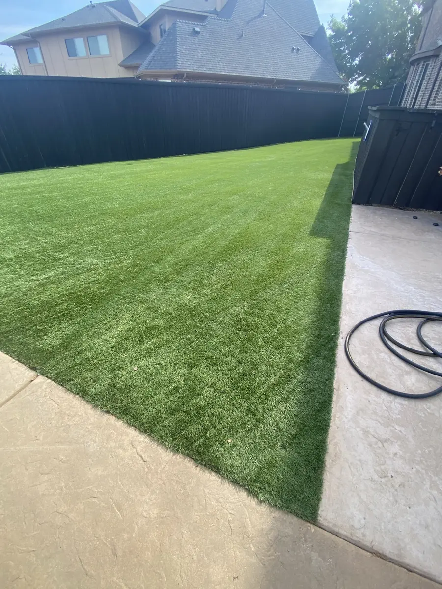 Large artificial turf lawn after residential service